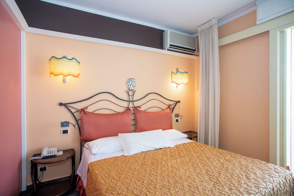 Standard Double or Twin Room | Minibar, in-room safe, desk, laptop workspace