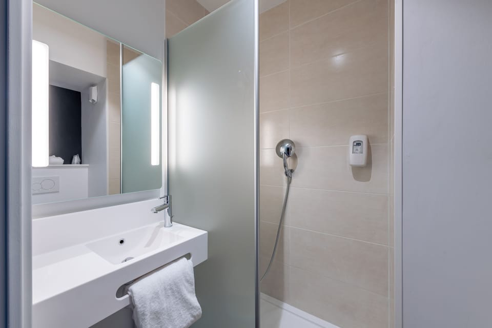 Shower, towels, soap, toilet paper