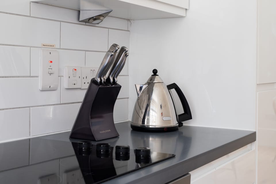 Luxury Suite, 1 Bedroom | Private kitchen | Full-size fridge, microwave, oven, dishwasher
