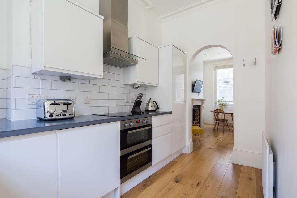 Luxury Suite, 1 Bedroom | Private kitchen | Full-size fridge, microwave, oven, dishwasher