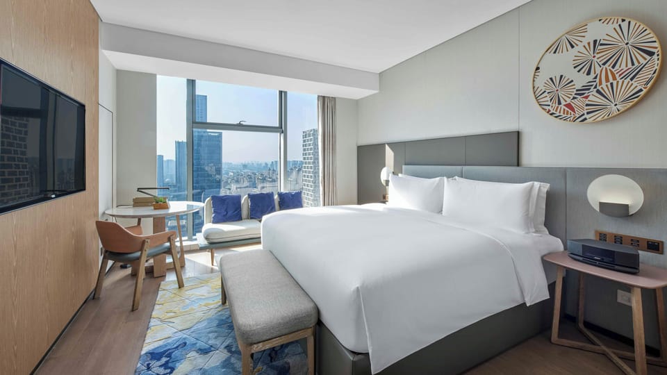 Premium bedding, down comforters, pillowtop beds, free minibar