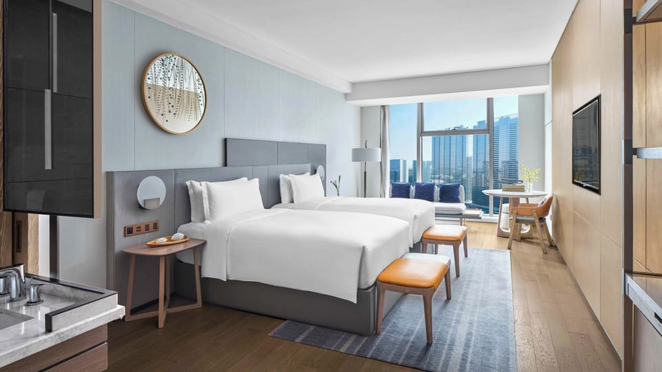 Premium bedding, down comforters, pillowtop beds, free minibar