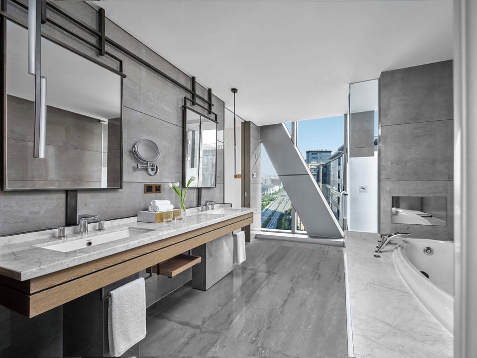 Separate tub and shower, rainfall showerhead, eco-friendly toiletries