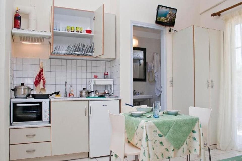 Fridge, electric kettle, cookware/dishes/utensils