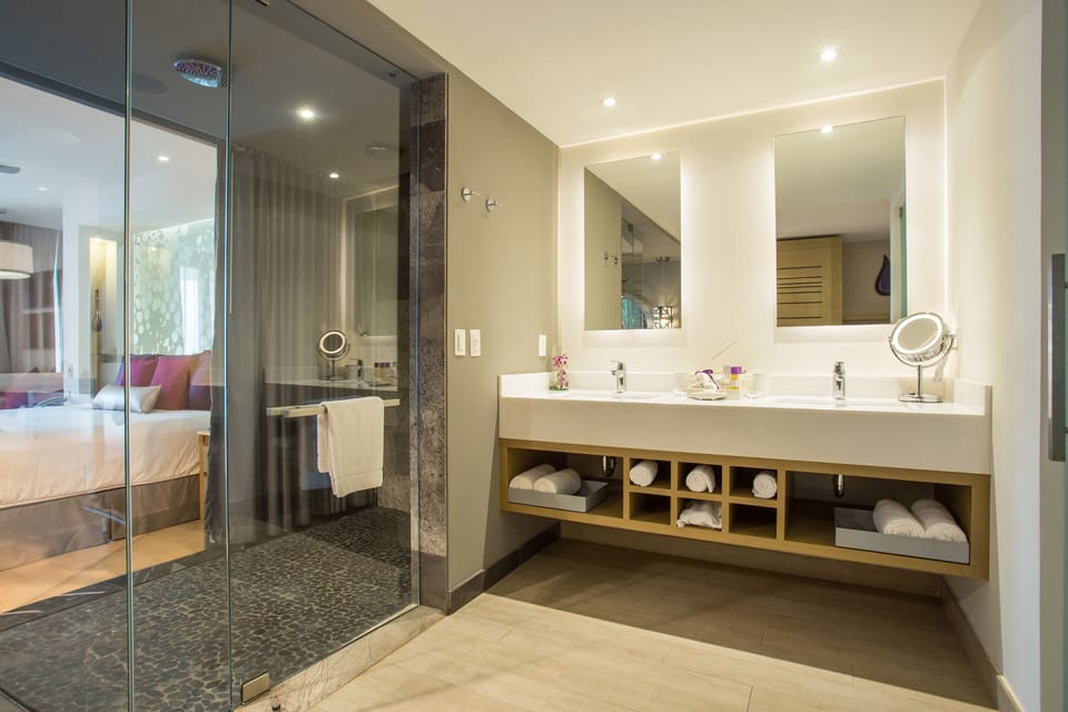 Shower, designer toiletries, hair dryer, bathrobes