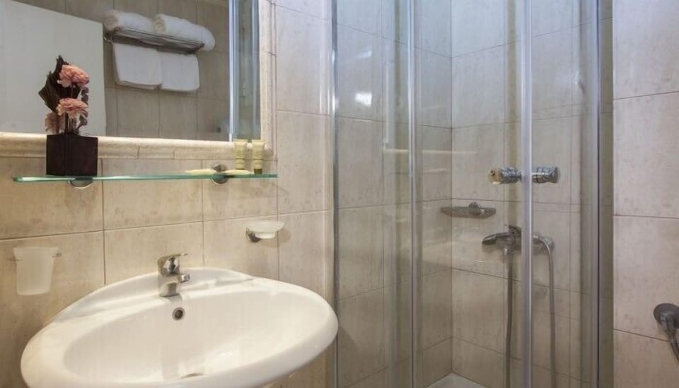 Shower, free toiletries, hair dryer, towels