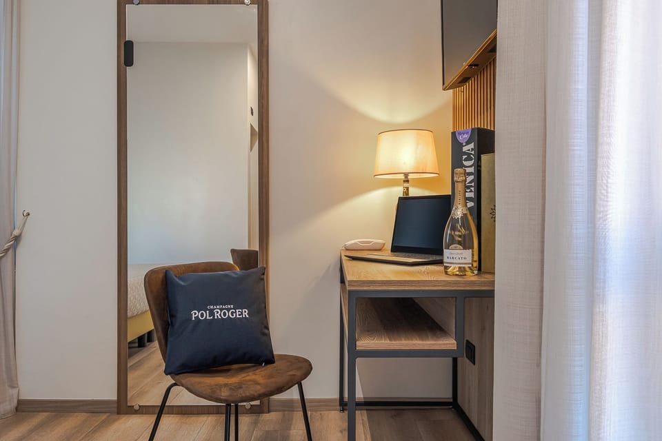 Twin Room | Minibar, in-room safe, desk, soundproofing