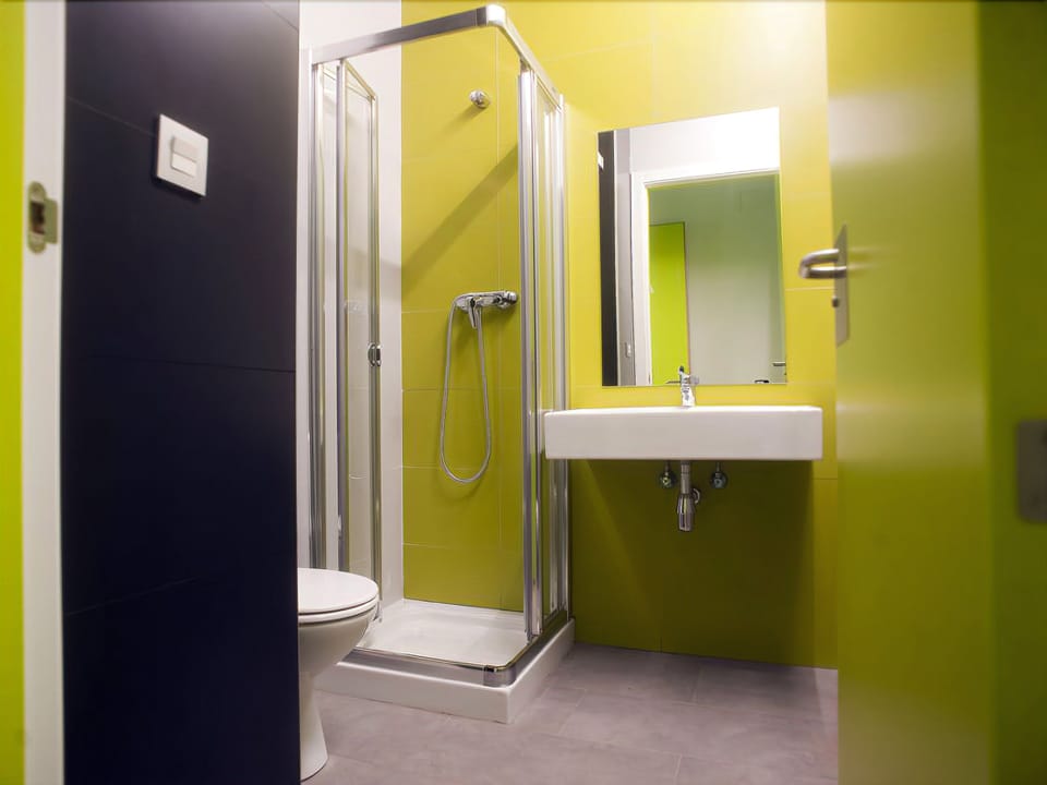 Bed in 6-Bed Dormitory Room | Bathroom | Shower, hair dryer, towels