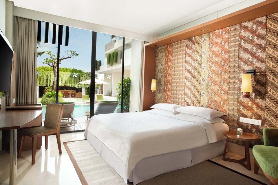 Deluxe Room, 1 King Bed, Pool Access | In-room safe, iron/ironing board, free cribs/infant beds, rollaway beds