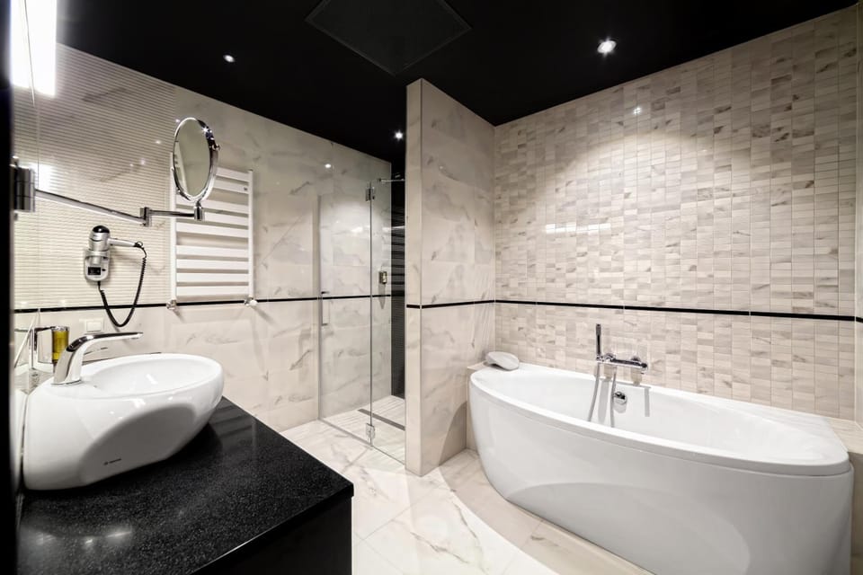 Designer toiletries, hair dryer, bathrobes, slippers