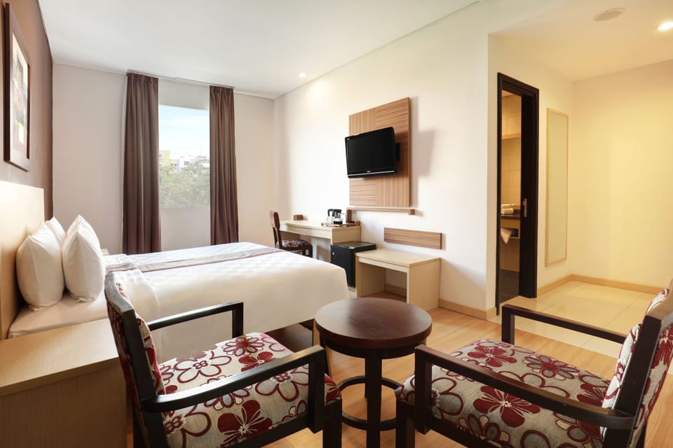 Executive Room | Down comforters, memory foam beds, minibar, in-room safe
