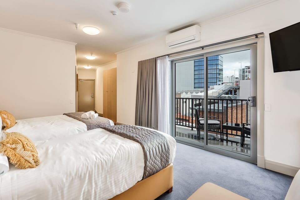 Deluxe Double or Twin Room, Multiple Beds, Non Smoking, Balcony | In-room safe, desk, free WiFi, bed sheets
