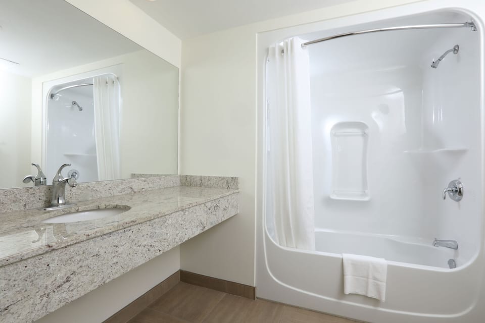 Deluxe Room, 2 Queen Beds | Bathroom | Hair dryer, towels