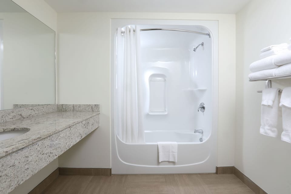 Deluxe Room, 2 Queen Beds | Bathroom | Hair dryer, towels
