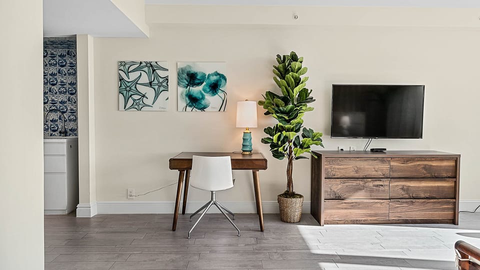 Deluxe Studio, 1 King Bed, Kitchenette, City View | Living area | 55-inch flat-screen TV with cable channels, TV