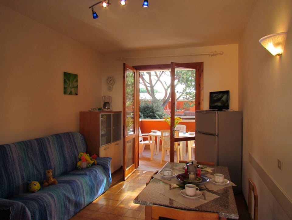 Apartment, 2 Bedrooms, Balcony, Pool View | Living room | TV