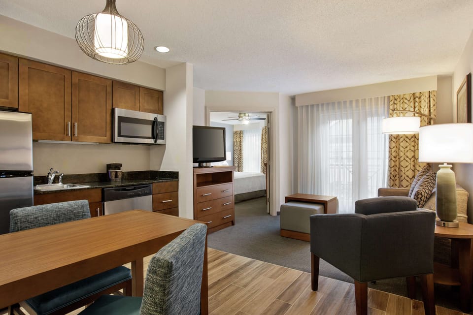 Suite, One King and One Sofa Bed, Non-Smoking | Pillowtop beds, desk, laptop workspace, blackout drapes