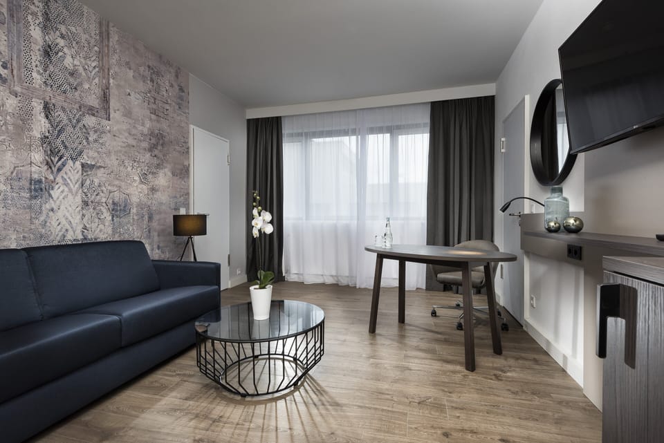 Suite, 1 Double Bed (Additional Living Area) | In-room safe, desk, blackout drapes, soundproofing
