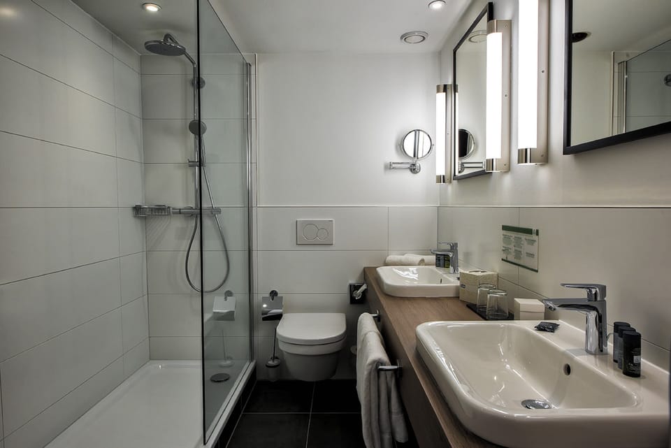 Combined shower/tub, eco-friendly toiletries, hair dryer, slippers