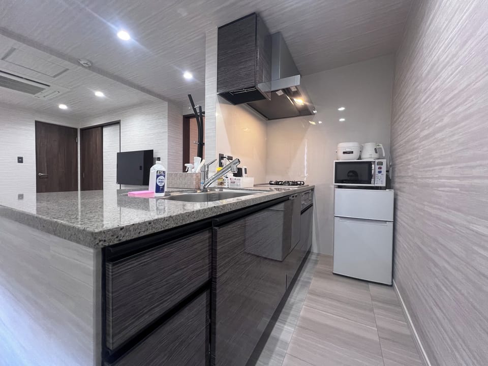Super Suite, Non Smoking | Private kitchen | Fridge, microwave, electric kettle, cookware/dishes/utensils
