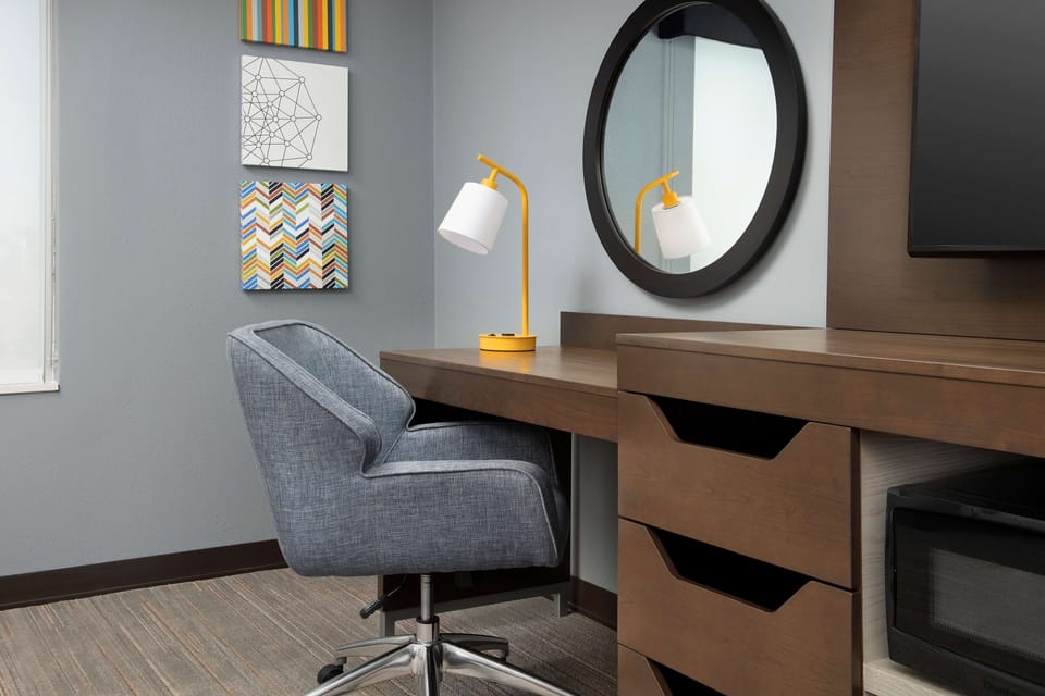 Desk, laptop workspace, bed sheets