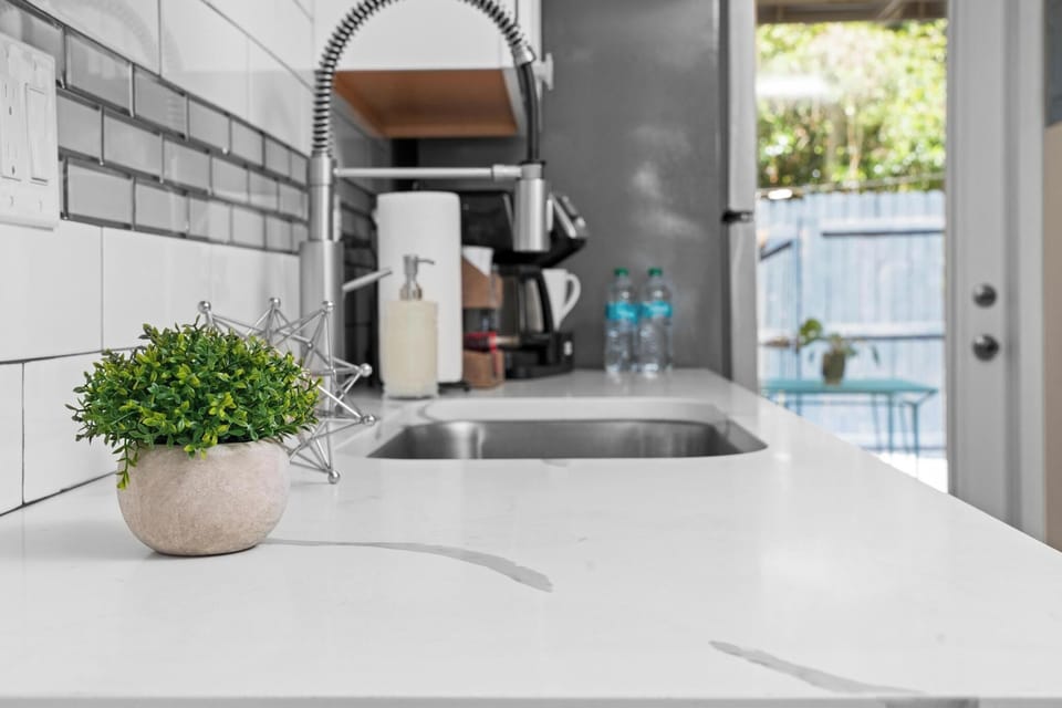 Deluxe Studio, Private Bathroom (Lily Room) | Private kitchenette | Coffee/tea maker, cookware/dishes/utensils, paper towels