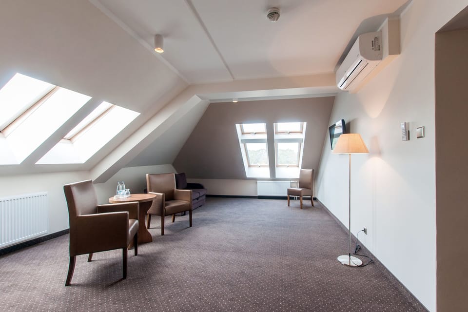 Superior Triple Room | Living area | 32-inch LCD TV with cable channels, TV