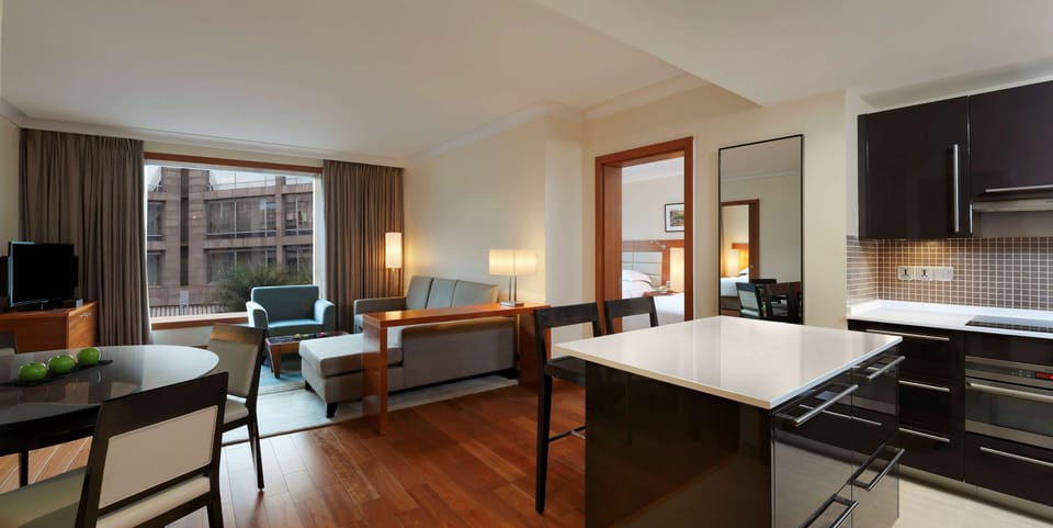 Deluxe Suite, Multiple Beds, Kitchenette | Down comforters, minibar, in-room safe, individually decorated