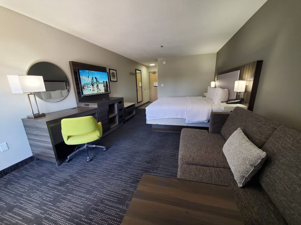 Room, 1 King Bed with Sofa bed, Non Smoking | Living area | 55-inch LCD TV with cable channels, TV, pay movies
