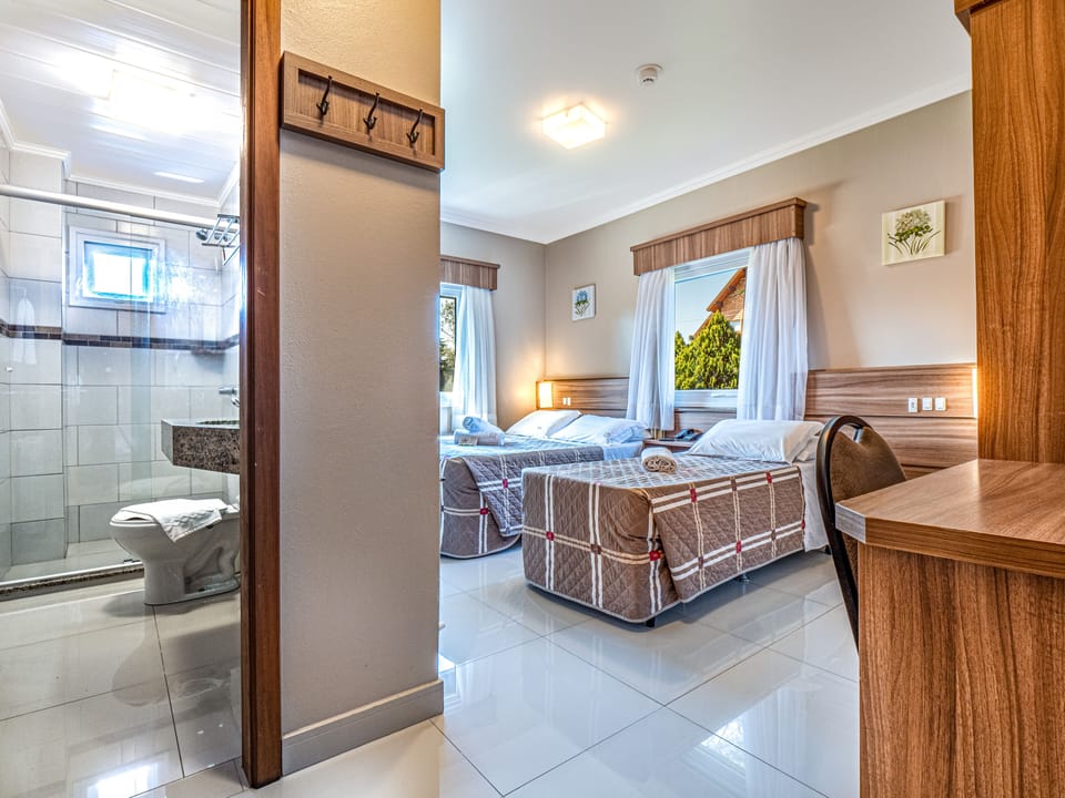 Triple Room | Minibar, in-room safe, desk, blackout drapes
