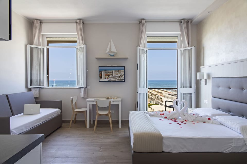 Double or Twin Room, Sea View | 1 bedroom, memory foam beds, minibar, in-room safe