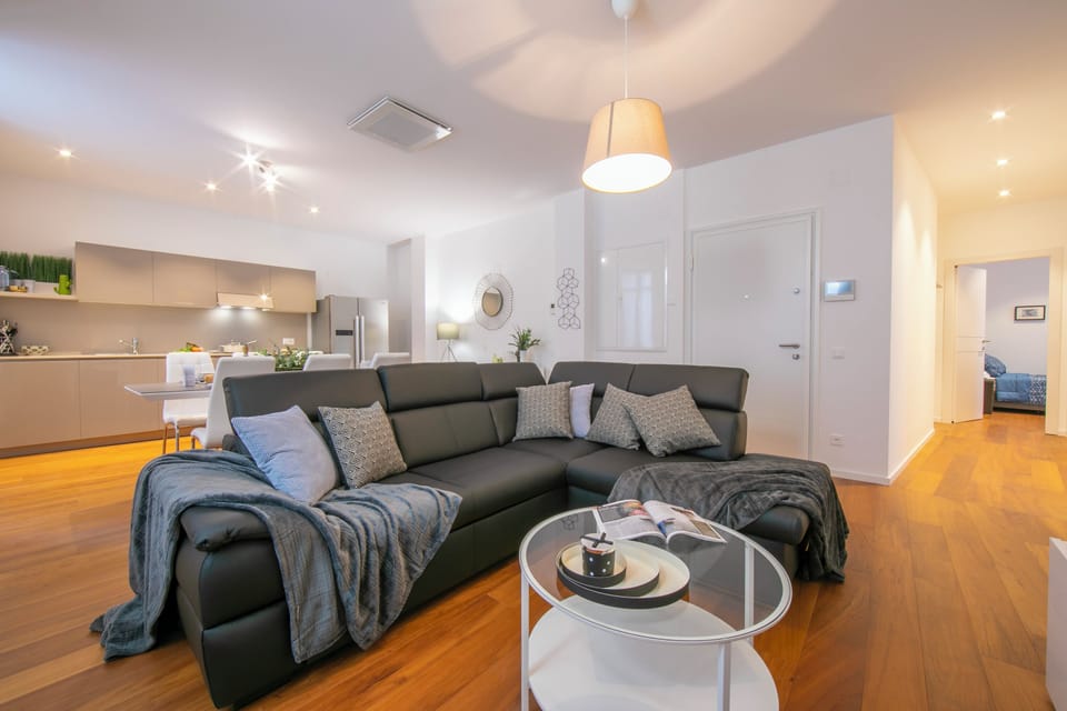Family Apartment, 2 Bedrooms, 2 Bathrooms (Star of Lugano) | Living area | 21-inch TV with satellite channels