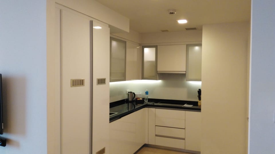 Deluxe Room, 2 Bedrooms | Private kitchen | Full-size fridge, microwave, coffee/tea maker, electric kettle