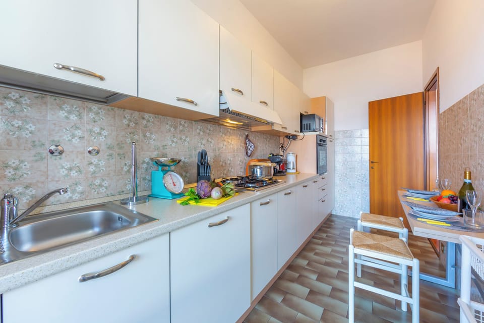 Family Apartment, Multiple Bedrooms, Mountainside (La Rosa Dei Venti Lake View Terrace) | Private kitchen | Fridge, microwave, oven, stovetop