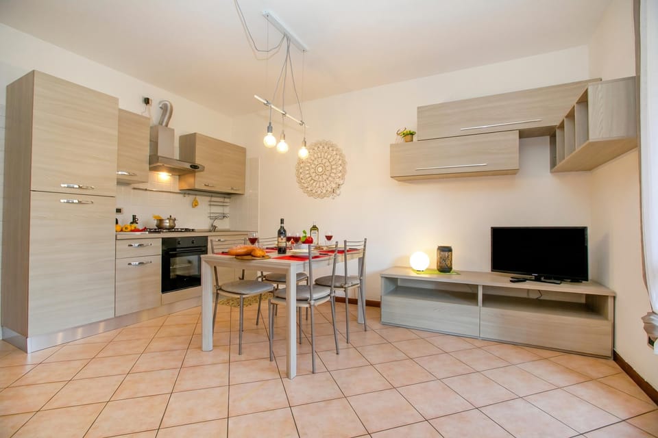 Family Apartment, Multiple Bedrooms (Borgo Degli Ulivi shared pool- 200m) | Living area | TV