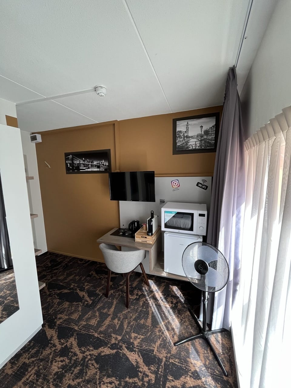 Desk, laptop workspace, blackout drapes, iron/ironing board