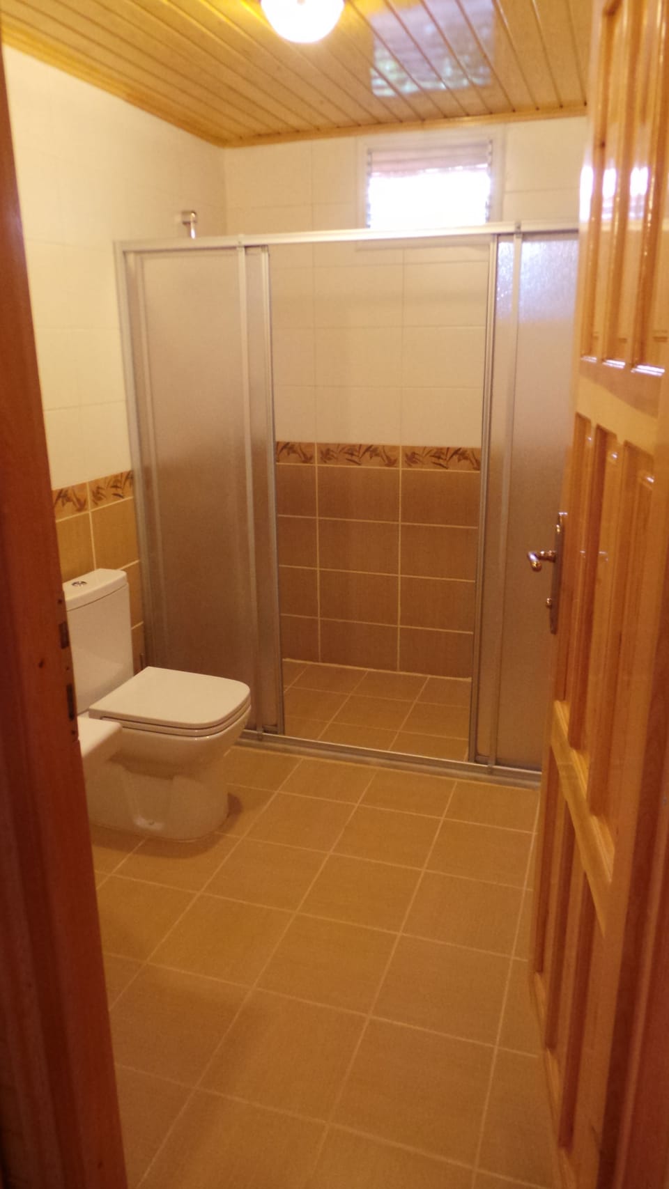 Shower, hair dryer, slippers, towels