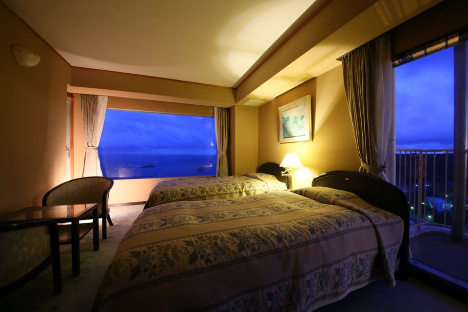 Corner Suite with Ocean View | Premium bedding, minibar, in-room safe, blackout drapes