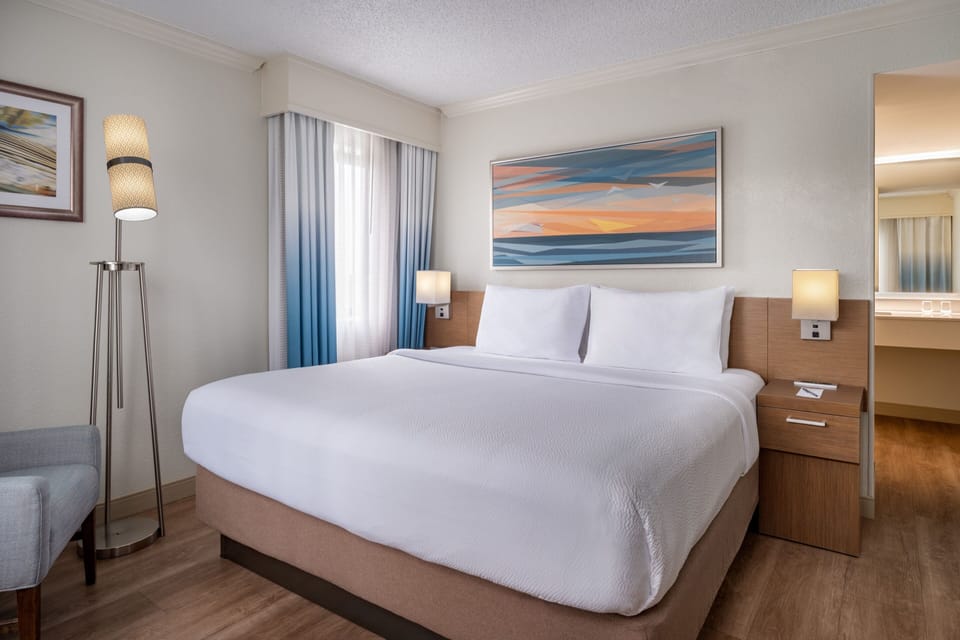 Suite, 1 King Bed with Sofa bed, Balcony | Premium bedding, in-room safe, blackout drapes, iron/ironing board