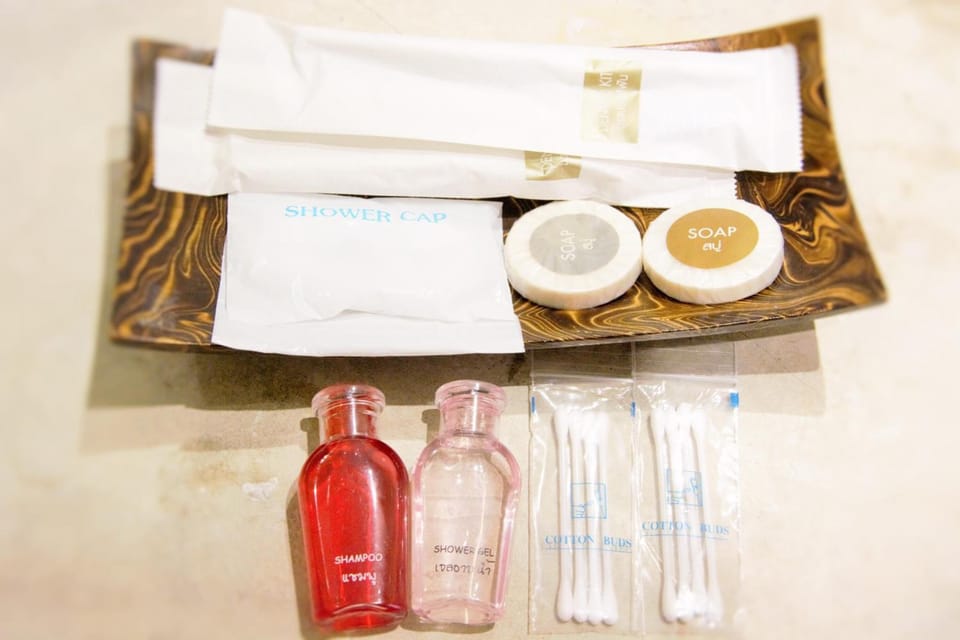 Shower, rainfall showerhead, hair dryer, towels