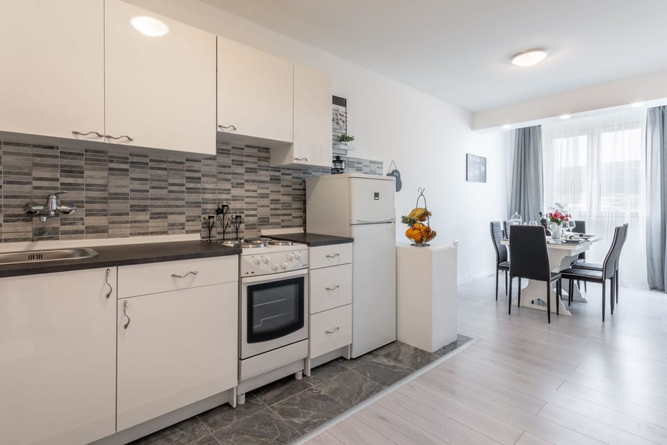 Apartment (Two Bedroom Apartment with Balcony) | Private kitchen | Fridge, stovetop, coffee/tea maker, electric kettle