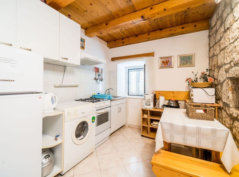 House (Four Bedroom Villa with Terrace and S) | Private kitchen | Fridge, cookware/dishes/utensils