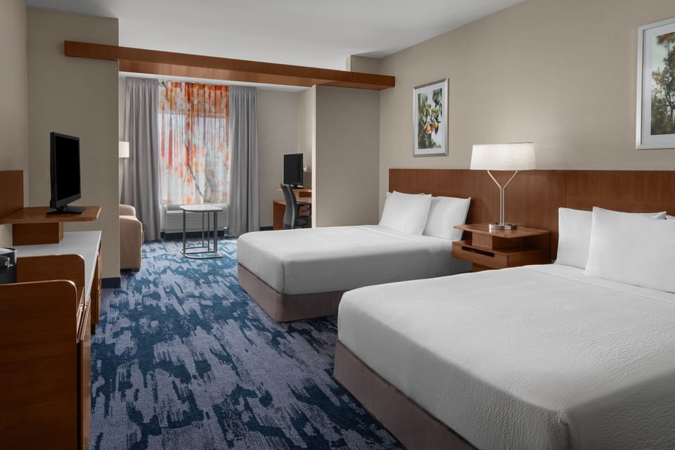 Premium bedding, desk, laptop workspace, iron/ironing board
