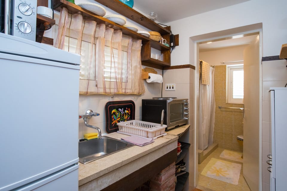 Studio (Studio Apartment with Private Beach a) | Private kitchenette | Fridge