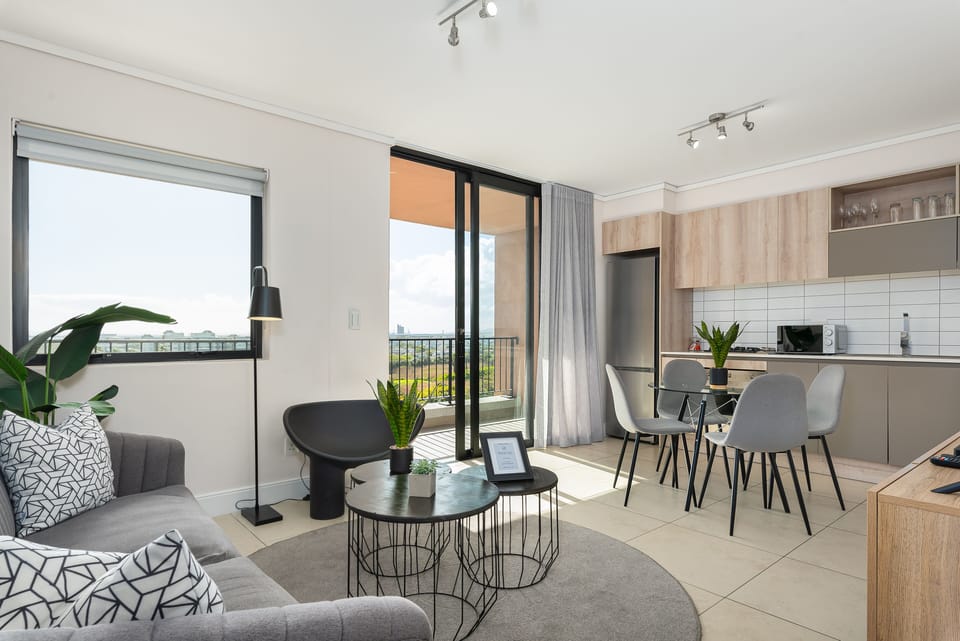 Grand Apartment | Living area | Flat-screen TV