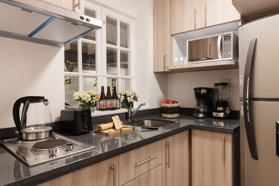 Signature Apartment | Private kitchen | Fridge, microwave, stovetop, coffee/tea maker