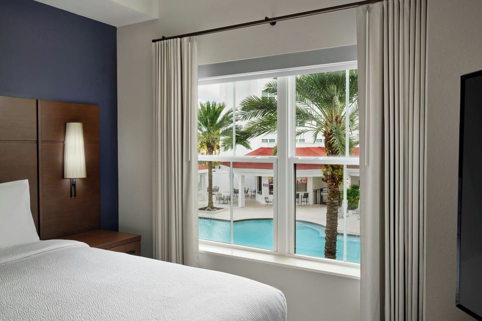 Studio, 1 King Bed, Non Smoking, Pool View | Pool | Outdoor pool, open 8:00 AM to 11:00 PM, pool umbrellas, sun loungers