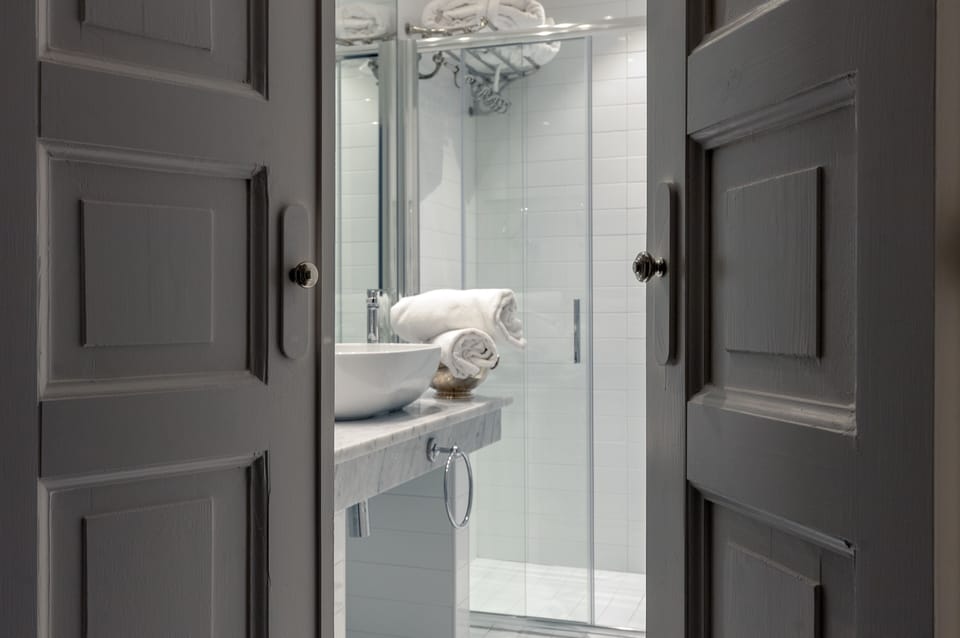Designer toiletries, hair dryer, bathrobes, slippers