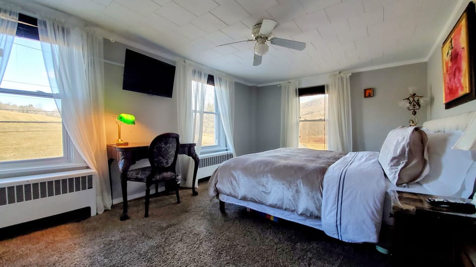 Private Bathroom to Fiddler On The Roof - 1 King Bed, Private Bathroom | Down comforters, memory foam beds, individually decorated