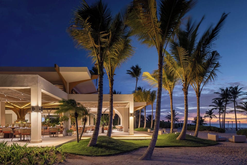 On the beach, white sand, sun loungers, beach umbrellas